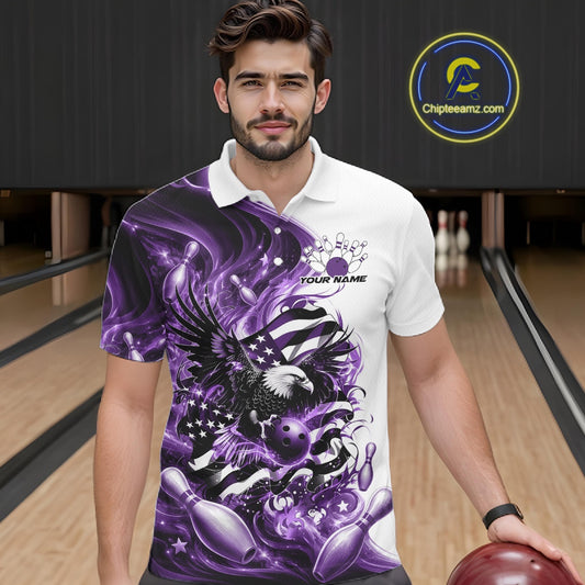 Male model front view in a bowling lane wearing a white and purple bowling polo shirt with eagle artwork and flowing flag inspired accents.