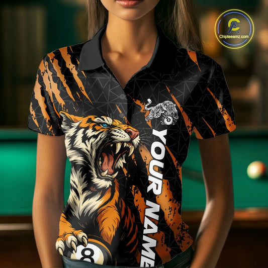Front view of a female model wearing a polo shirt with a roaring tiger gripping billiard balls through orange claw marks.