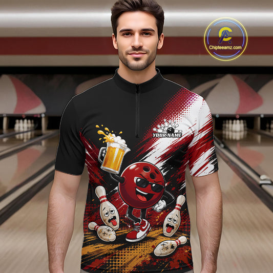A man wearing a custom bowling-themed short-sleeve quarter-zip shirt with a red and black graphic design featuring a cartoon bowling ball, pins, and beer, set against a blurred bowling alley background.