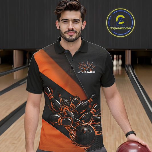 Male model seen from the front in a bowling lane wearing a black and orange polo shirt featuring a flame bowling ball striking pins in a dynamic action scene.