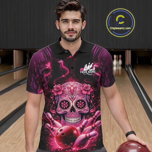 Male model in a bowling lane wearing a black and pink polo shirt with sugar skull and bowling-themed artwork.