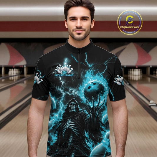 A man wearing a black short-sleeve quarter-zip bowling-themed graphic shirt with a skeleton and blue lightning design, set against a bowling alley background.