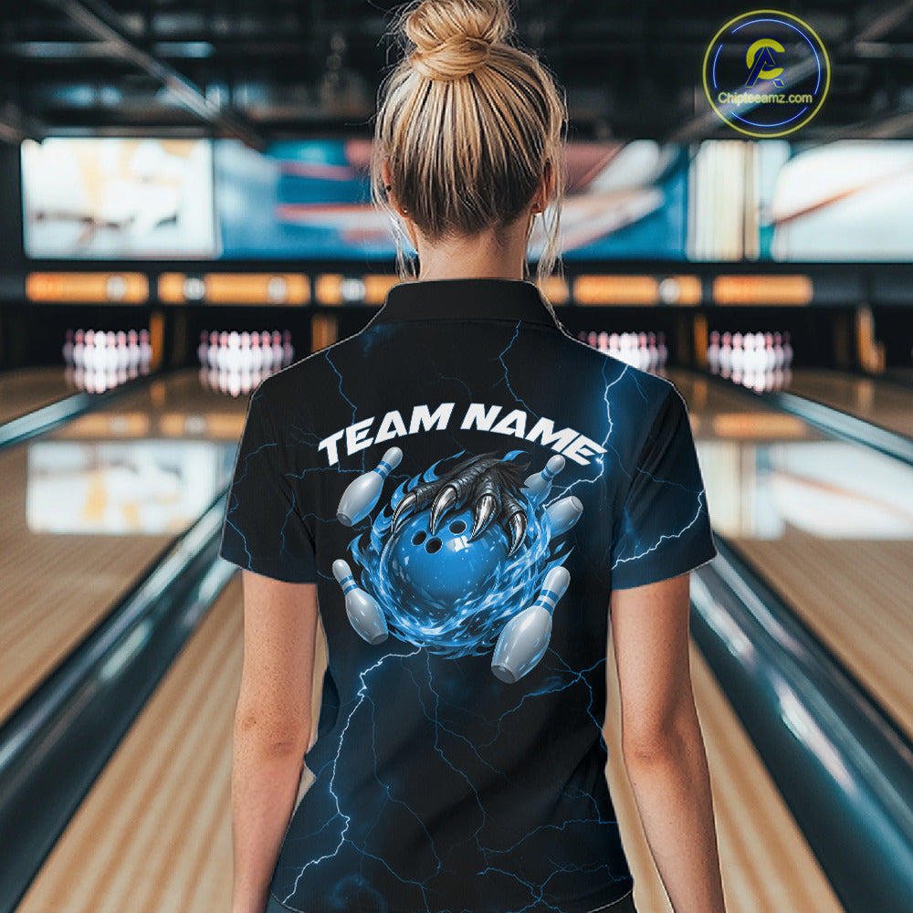 Back view of a black and blue womens quarter-zip showcasing flaming bowling ball and lightning artwork.