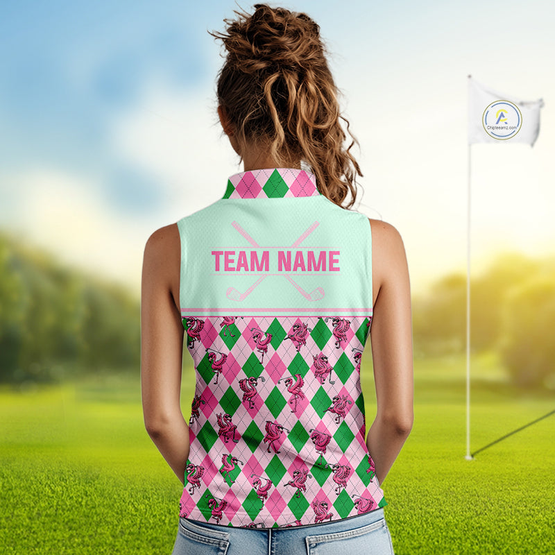 A woman viewed from behind wearing a sleeveless collared golf shirt with a pastel mint back panel reading 'TEAM NAME' and a pink, green, and white argyle floral pattern on the sleeves and lower body. The background is a blurred golf course with a flagstick and bright sky.