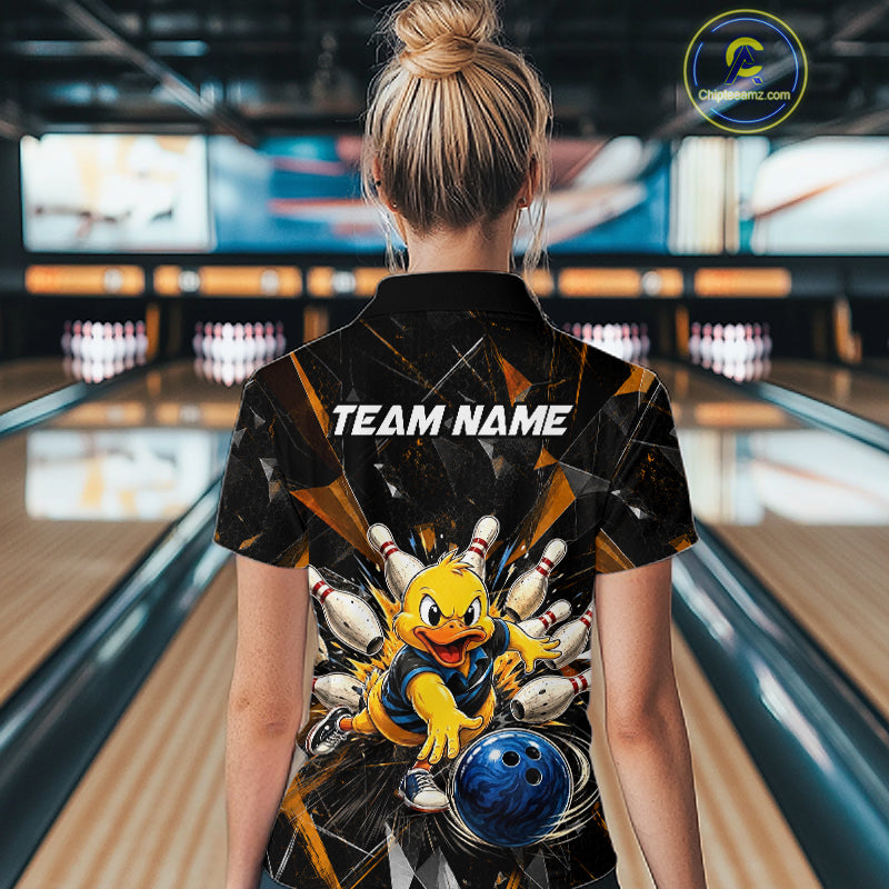 Female model wearing a custom black duck bowling quarter-zip shirt back view displaying the personalized team name above a playful cartoon graphic at the bowling alley