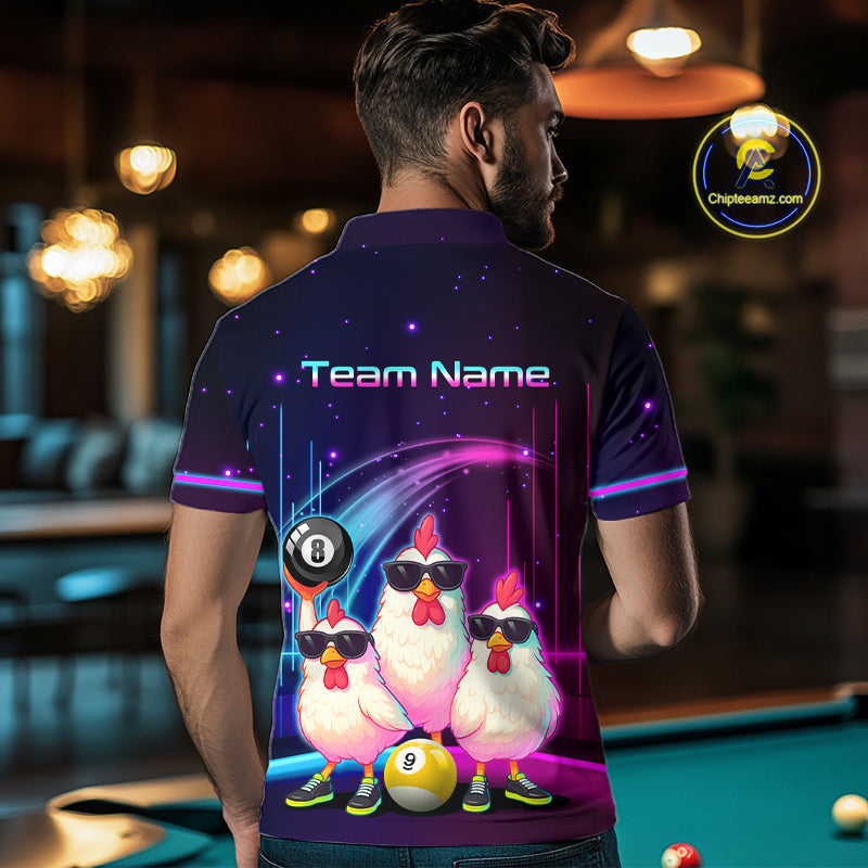 A man viewed from behind wearing a custom-printed short-sleeve polo shirt in a pool hall setting. The shirt features a dark purple and black base with a colorful graphic of three cartoon chickens wearing sunglasses, a billiard ball, and the text 'Team Name'.