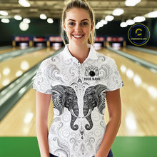Load image into Gallery viewer, Woman wearing custom black &amp; white tribal elephant bowling polo shirt, front view mockup, personalized bowling league jersey.