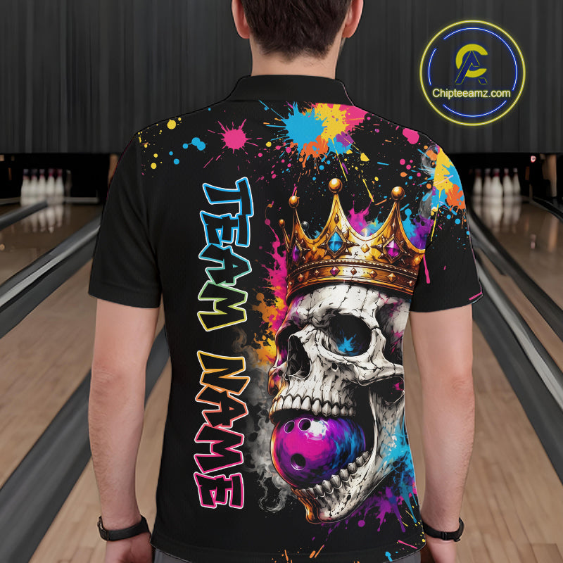 Person wearing a black bowling shirt with colorful design and 'Team Name' text in a bowling alley.
