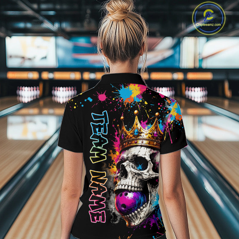Person wearing a colorful bowling shirt with a skull design in a bowling alley.