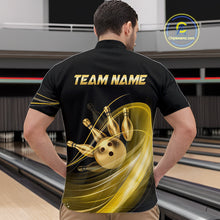 Load image into Gallery viewer, Man wearing a black bowling shirt with gold graphics and 'TEAM NAME' text in a bowling alley.