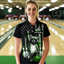 Load image into Gallery viewer, Woman wearing a black shirt with a raccoon design in a bowling alley.