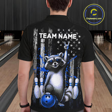 Load image into Gallery viewer, Person wearing a black shirt with a raccoon graphic and 'TEAM NAME' text in a bowling alley.