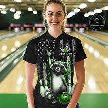 Load image into Gallery viewer, Person wearing a black shirt with a raccoon design in a bowling alley.
