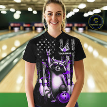 Load image into Gallery viewer, Person wearing a black shirt with a raccoon graphic and text in a bowling alley.
