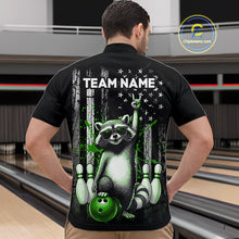Load image into Gallery viewer, Person wearing a black shirt with a raccoon graphic and 'TEAM NAME' text in a bowling alley.