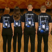 Load image into Gallery viewer, Four people wearing black shirts with a raccoon and bowling design on a bowling alley background.