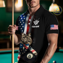 Load image into Gallery viewer, A front view of a custom black billiards polo shirt worn by a male model holding a pool cue. The shirt features a distressed US flag design on one side and a cartoon cat in vest with its paw on an 8-ball on the front. A 'YOUR NAME' text placeholder is positioned below a crossed pool cues icon. The background is a blurred billiards room with a green pool table.