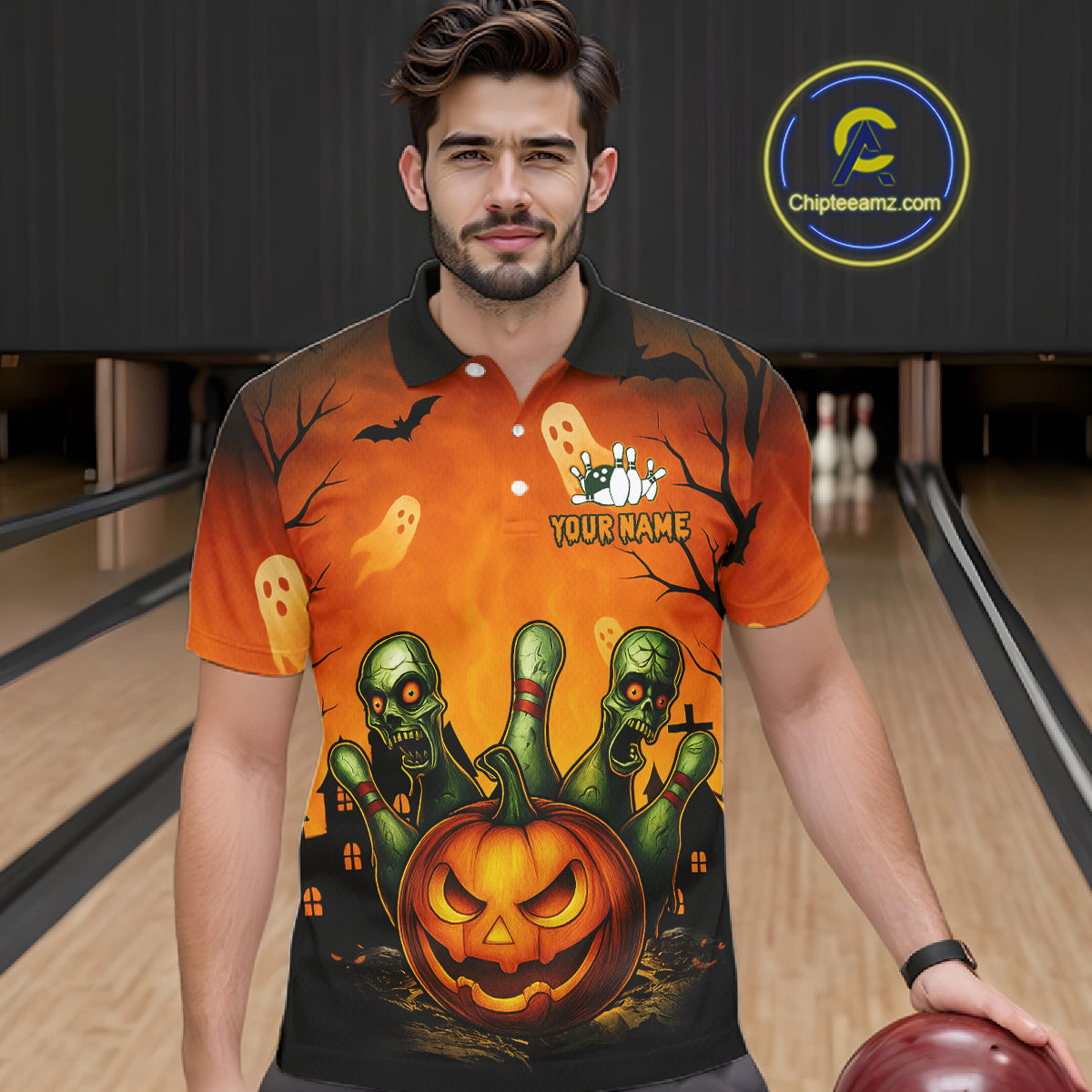 Man wearing a Halloween-themed polo shirt with a pumpkin and zombie design in a bowling alley.