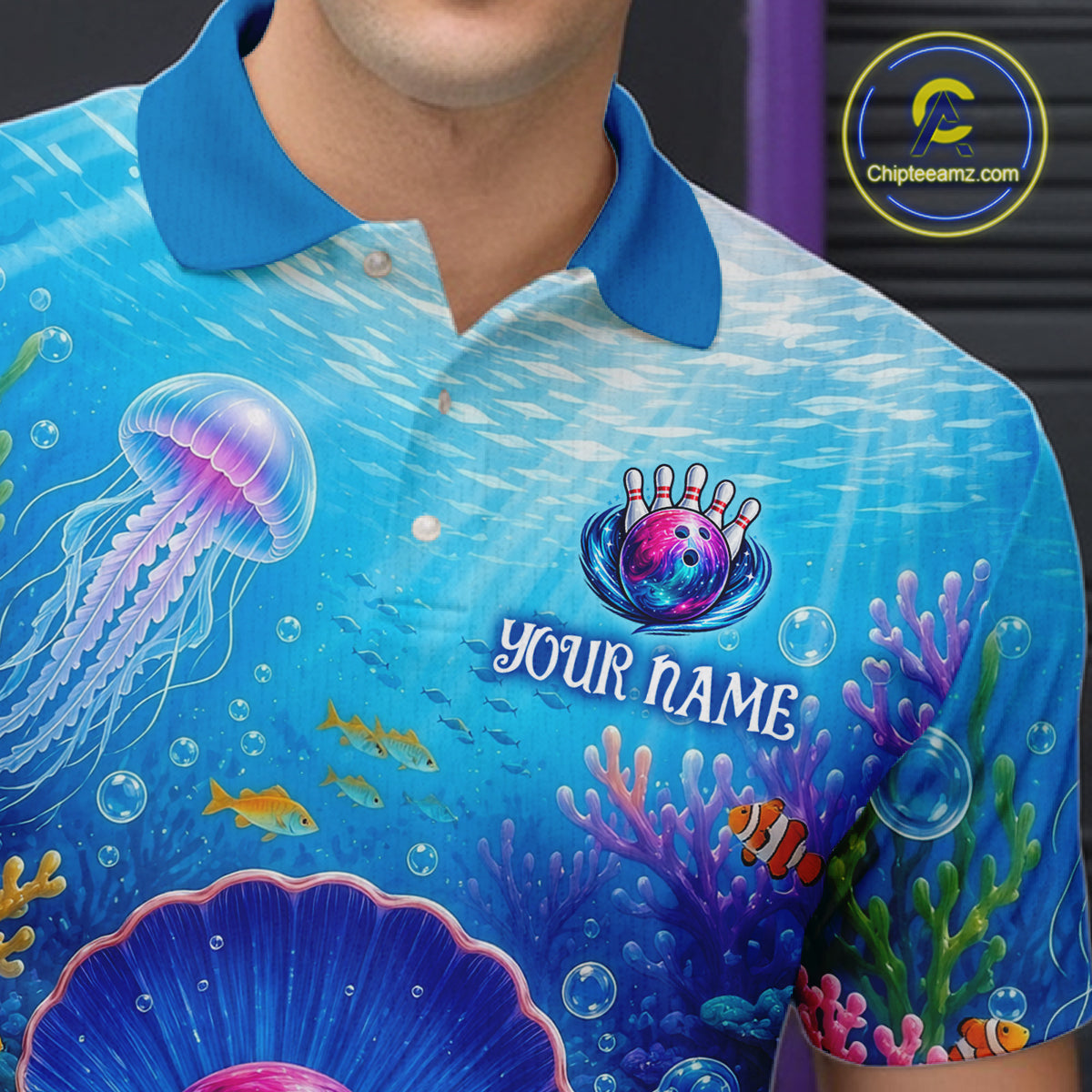 Blue polo shirt with underwater design and 'Your Name' text, brand logo visible.