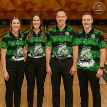 Load image into Gallery viewer, Four people standing together in a bowling alley wearing matching green and black striped polo shirts with a frog graphic on the front, paired with black pants. A bowling lane and wooden wall are visible in the background.