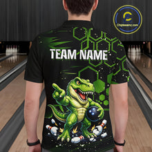 Load image into Gallery viewer, A person standing in a bowling alley viewed from behind, wearing a black short-sleeve bowling shirt with a large green dinosaur graphic, bowling pins, hexagon pattern, and the text 'TEAM NAME' on the back. A circular 'Chipteeamz.