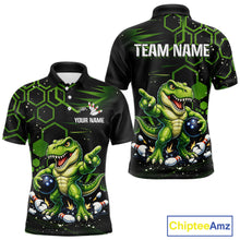 Load image into Gallery viewer, Front and back views of a black short-sleeve polo shirt with a green cartoon dinosaur graphic, white 'TEAM NAME' and 'YOUR NAME' text placeholders, and a ChipteeAmz logo in the bottom right corner.
