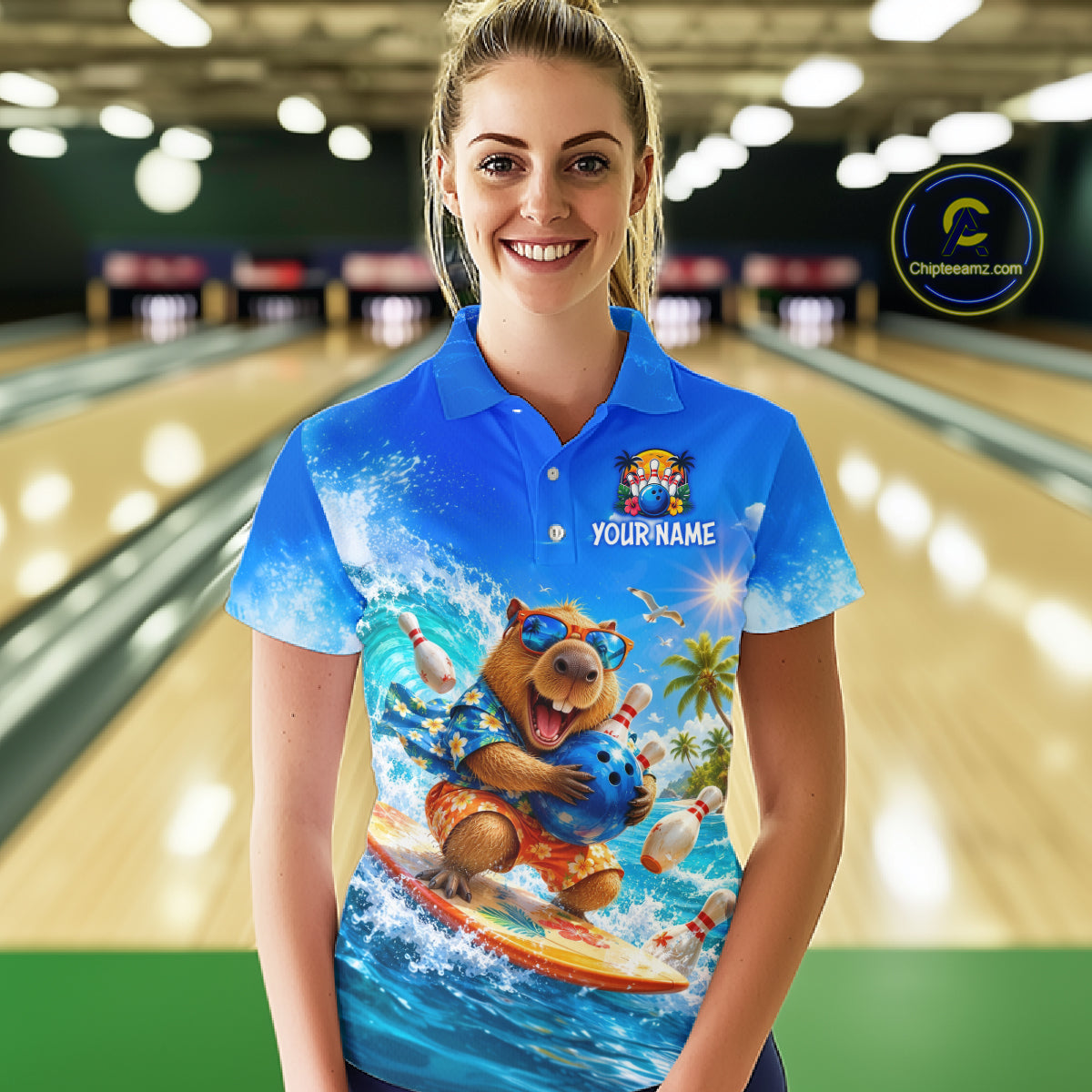 Person wearing a blue polo shirt with a bear graphic and 'Your Name' text in a bowling alley.