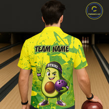 Load image into Gallery viewer, Person wearing a bright yellow bowling shirt with an avocado character and 'Team Name' text on a bowling alley background.