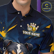 Load image into Gallery viewer, Close-up front view of a custom blue bulldog bowling polo shirt showing the personalized player name, fierce cartoon bulldog graphic and gold lightning accent design