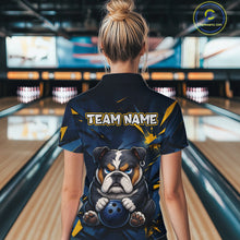 Load image into Gallery viewer, Female model wearing a custom blue bulldog bowling polo shirt back view displaying the personalized team name above a fierce cartoon bulldog graphic at the bowling alley