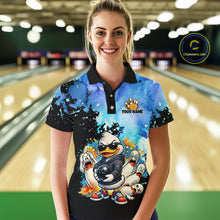 Load image into Gallery viewer, Woman wearing a colorful bowling shirt with cartoon characters in a bowling alley.