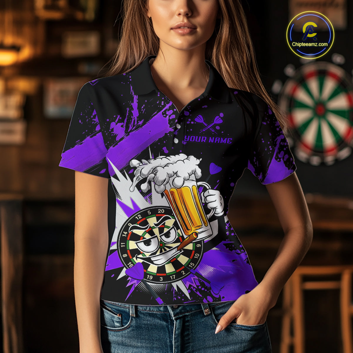 A woman wearing a black short-sleeve polo shirt with a purple and white graphic design featuring a cartoon dartboard and beer mug. The shirt has a 'YOUR NAME' placeholder on the chest.