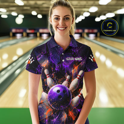 A woman stands in a bowling alley wearing a short-sleeve bowling-themed polo shirt with a purple and black cosmic bowling graphic, including bowling pins and a bowling ball. The shirt has 'YOUR NAME' printed on the chest.