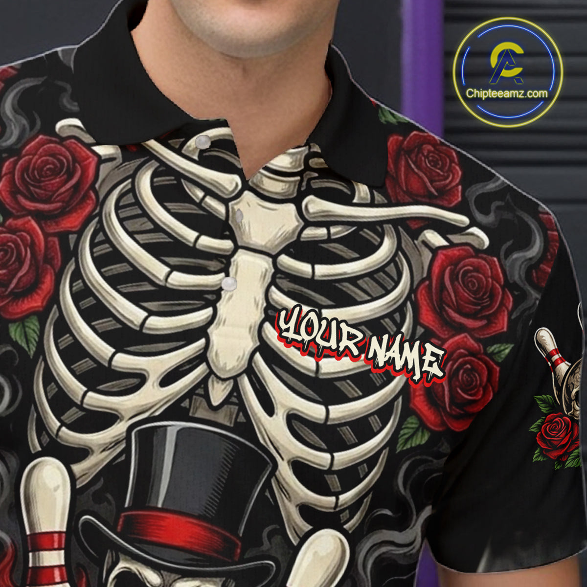 A close-up of a person wearing a black short-sleeve polo shirt with a large skeleton ribcage graphic, red roses, and a customizable text overlay reading 'YOUR NAME'.