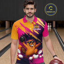 Load image into Gallery viewer, Man wearing a colorful bowling-themed shirt with a logo and text in a bowling alley.