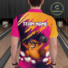 Load image into Gallery viewer, Person wearing a colorful bowling shirt with a cartoon beaver design on a bowling alley background