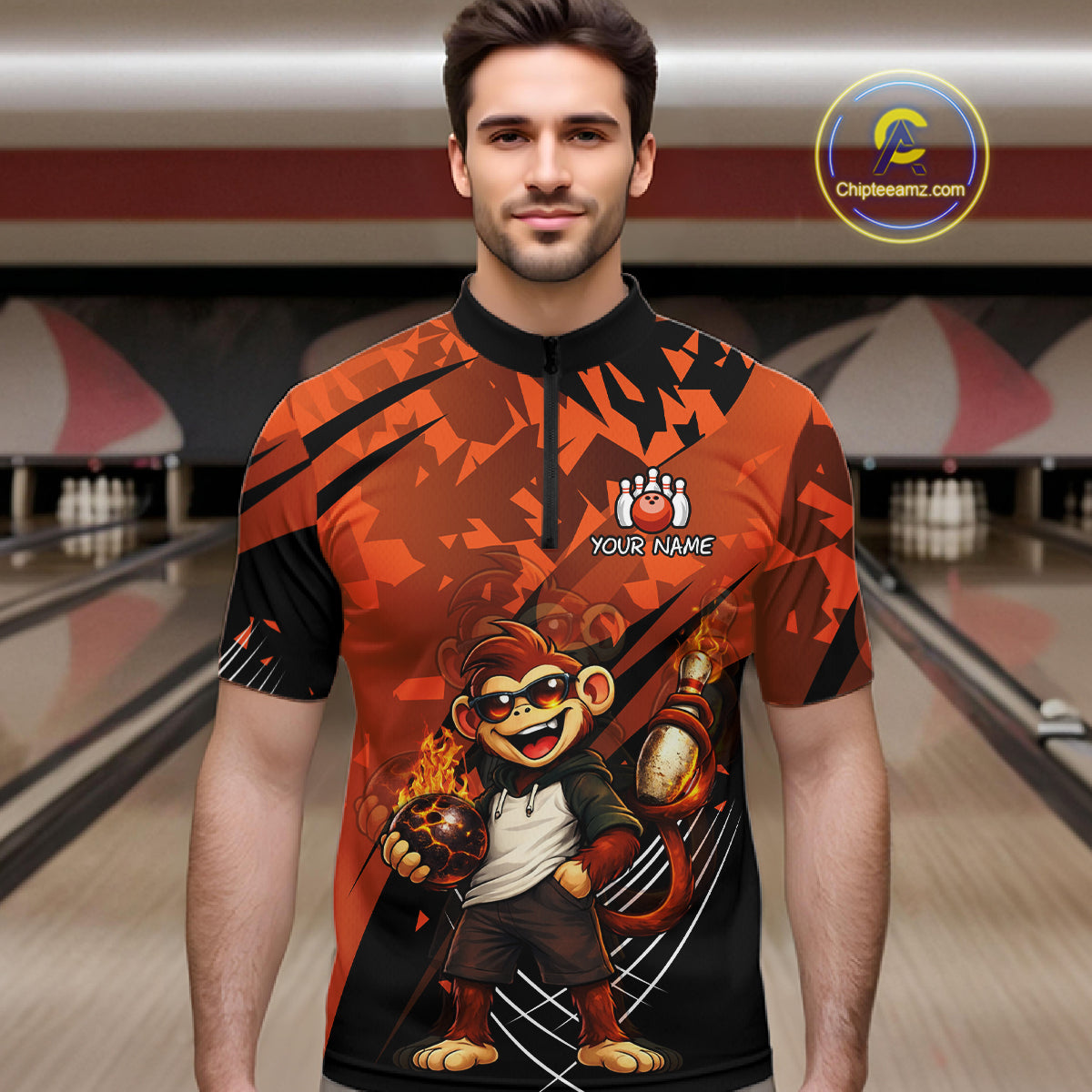 A man wearing a short-sleeve bowling jersey with a bold orange and black graphic design featuring a cartoon monkey holding bowling balls. The jersey has a black collar and the text 'YOUR NAME' with a paw print logo on the chest.