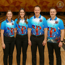 Load image into Gallery viewer, Four people wearing matching blue bowling shirts with lobster graphics on a bowling alley.
