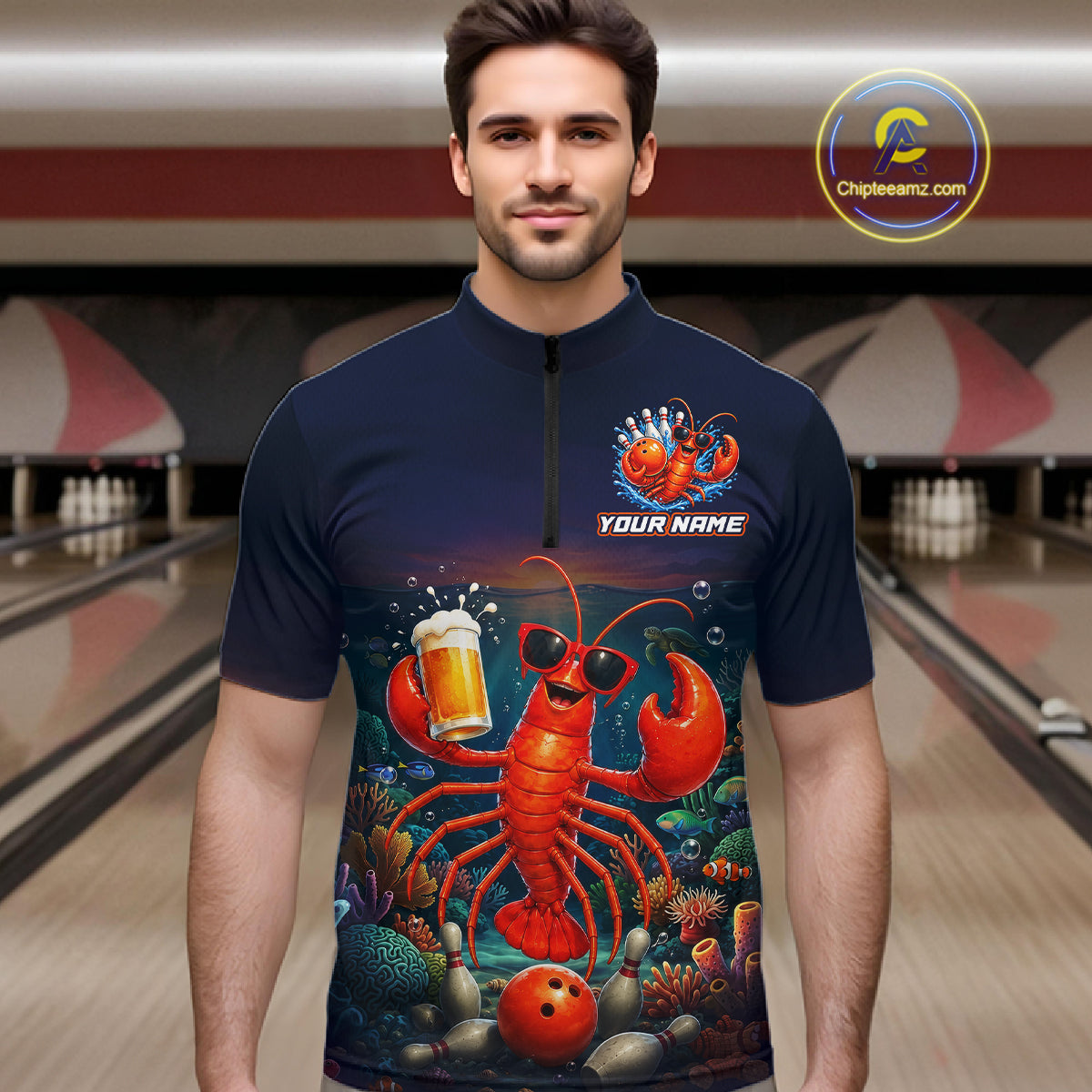 Man wearing a navy blue shirt with a lobster design in a bowling alley.