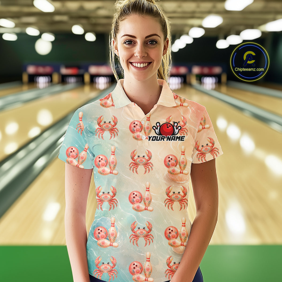 Woman wearing a colorful shirt with crab patterns in a bowling alley.