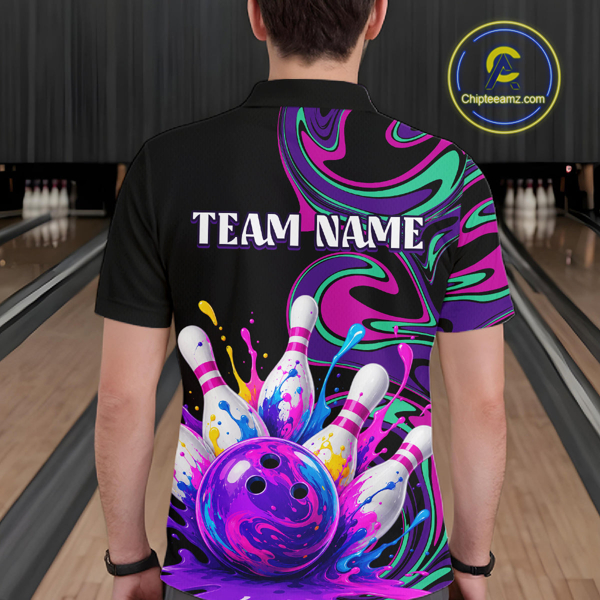 Person wearing a colorful bowling-themed shirt with 'TEAM NAME' text in a bowling alley.