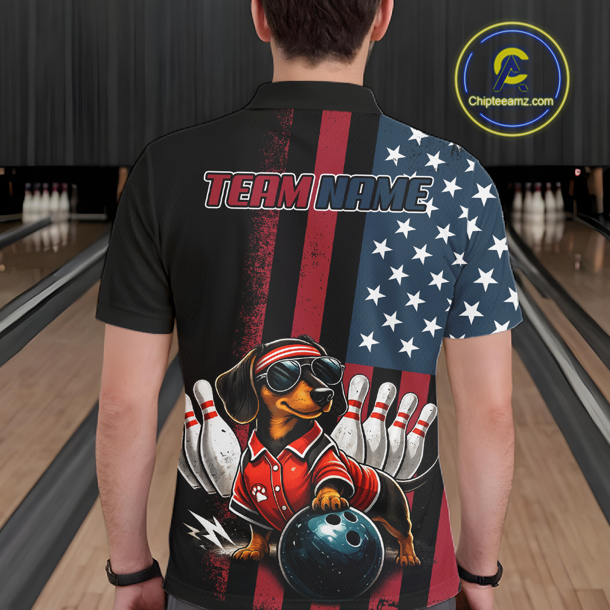 Person wearing a bowling-themed shirt with a dog graphic on a bowling alley.