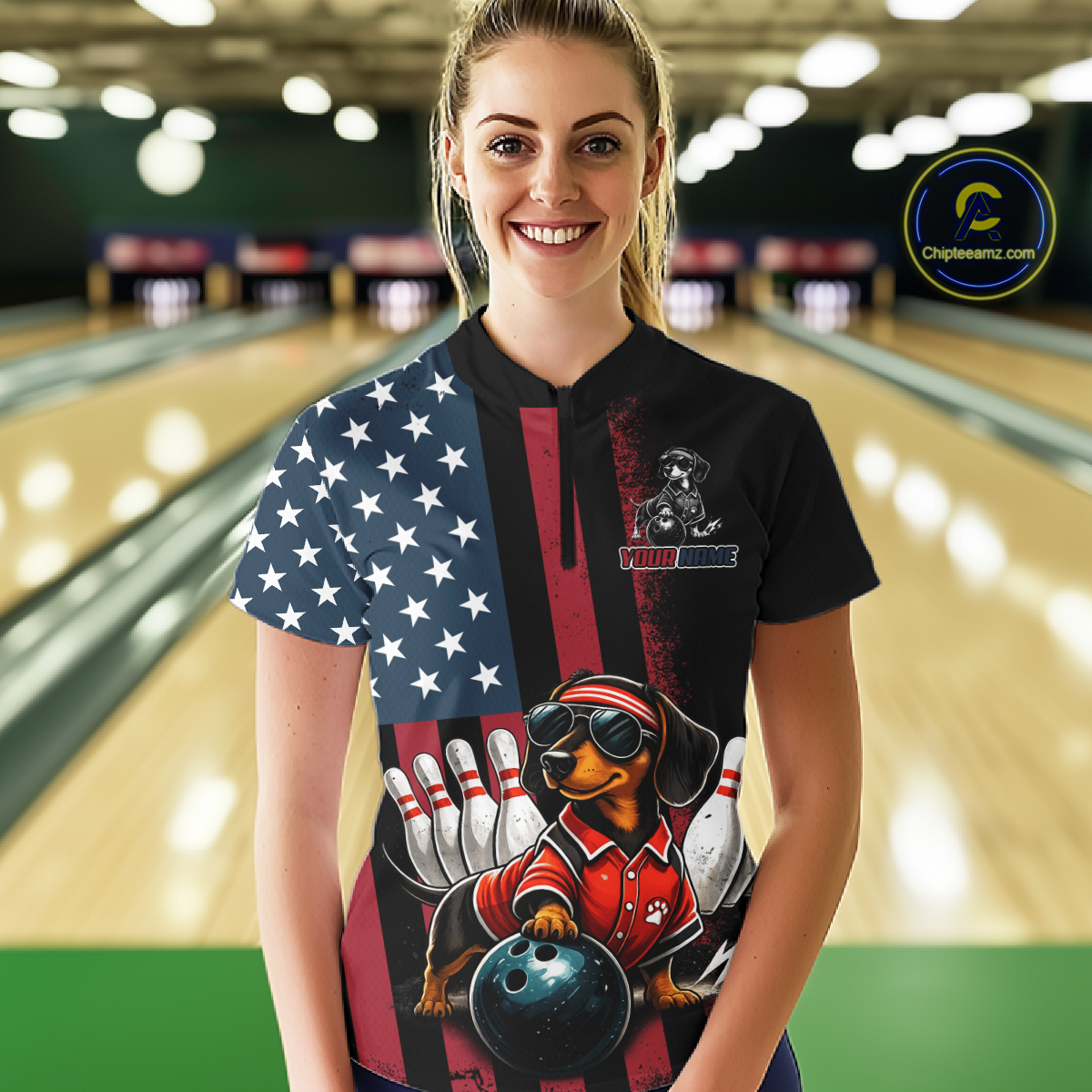 Person wearing a black shirt with a dog bowling design in a bowling alley.