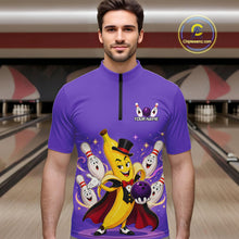 Load image into Gallery viewer, Man wearing a purple shirt with a cartoon character design in a bowling alley.