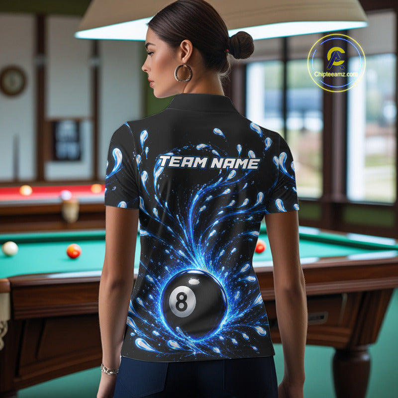 Person wearing a black shirt with a blue and white design and 'TEAM NAME' text, standing in a pool hall.