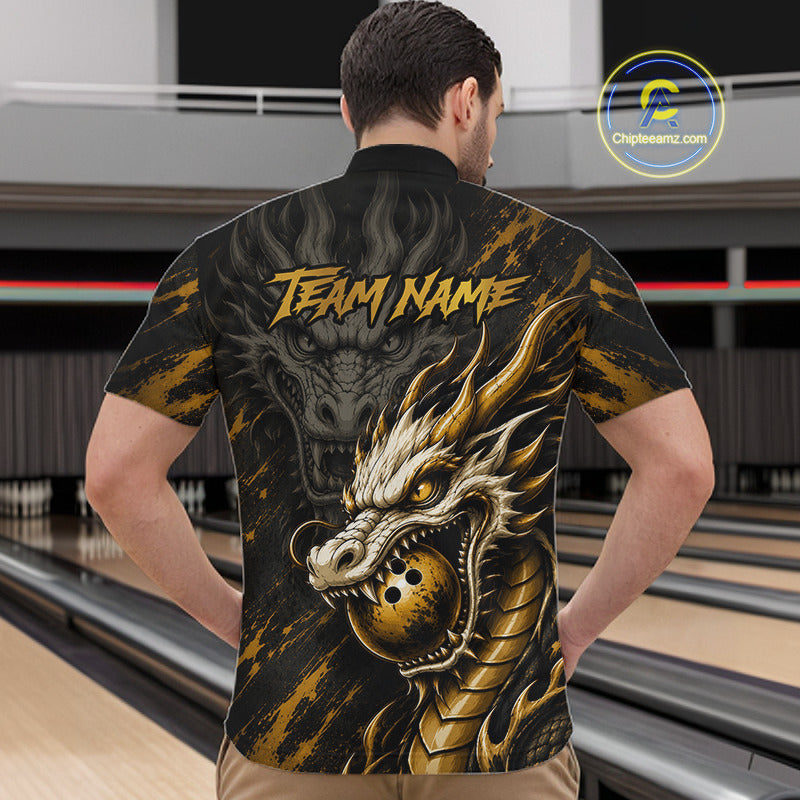 A man viewed from behind wearing a short-sleeve bowling shirt with a large gold and black dragon graphic and the text 'TEAM NAME' across the back. Bowling lanes are visible in the background