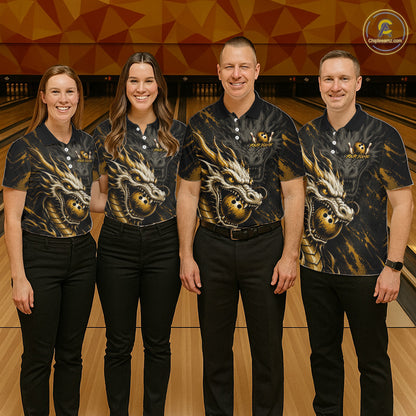 Four people standing together in a bowling alley wearing matching black short-sleeve polo shirts with a large gold and white dragon graphic on the front. The shirts have a small logo on the left chest, and the background shows bowling lanes and a geometric wall.