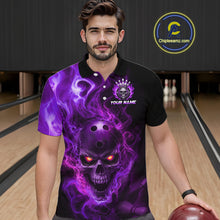 Load image into Gallery viewer, Man wearing a black bowling polo shirt featuring a flaming skull with glowing orange eyes, purple smoke effects, and custom “YOUR NAME” text.