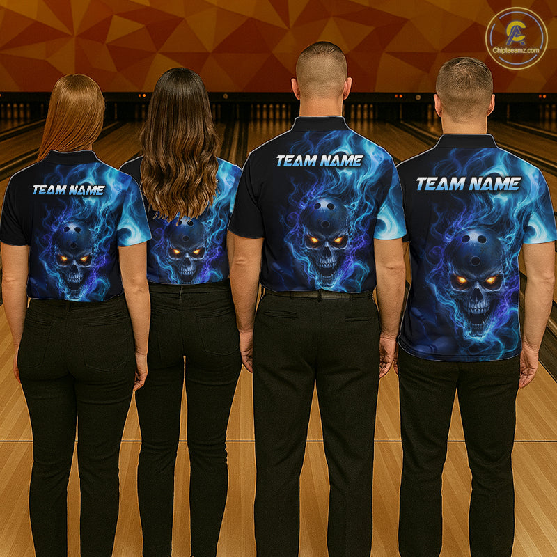 Four people wearing matching blue and black shirts with a skull design on a bowling alley.