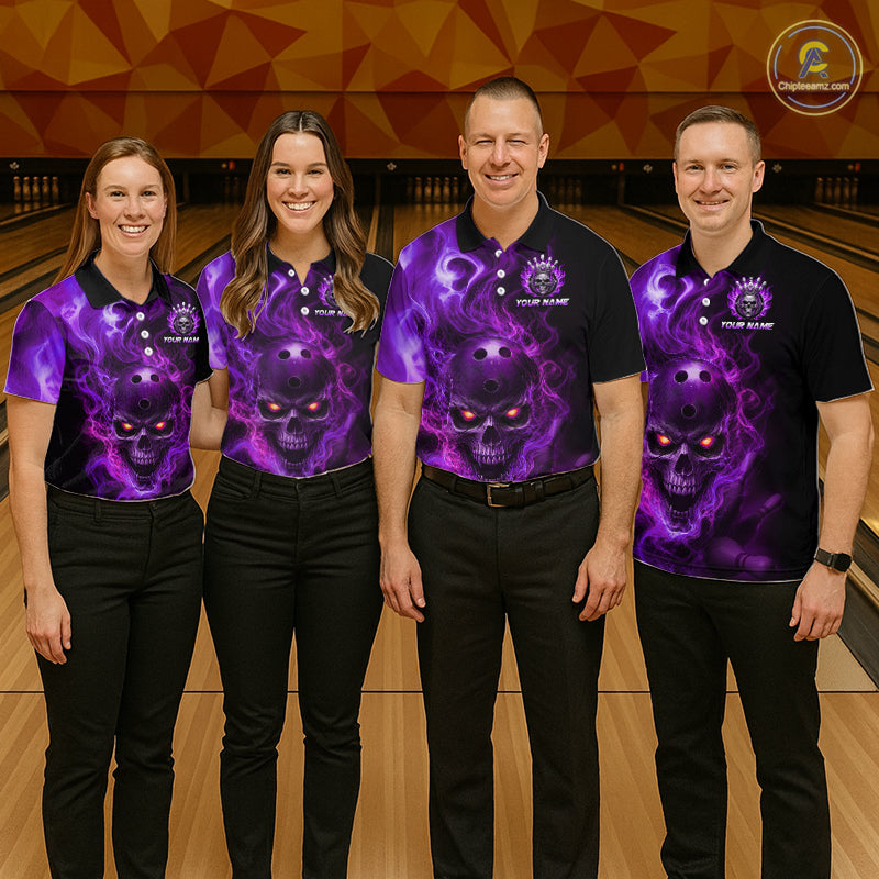 Four people wearing matching purple and black shirts with a skull design on a bowling alley.